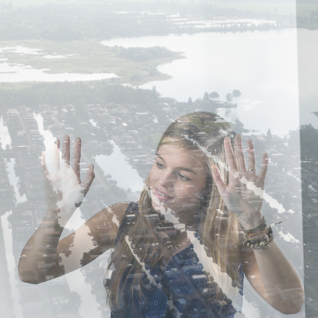 Dorothy looking through the window of the flying house