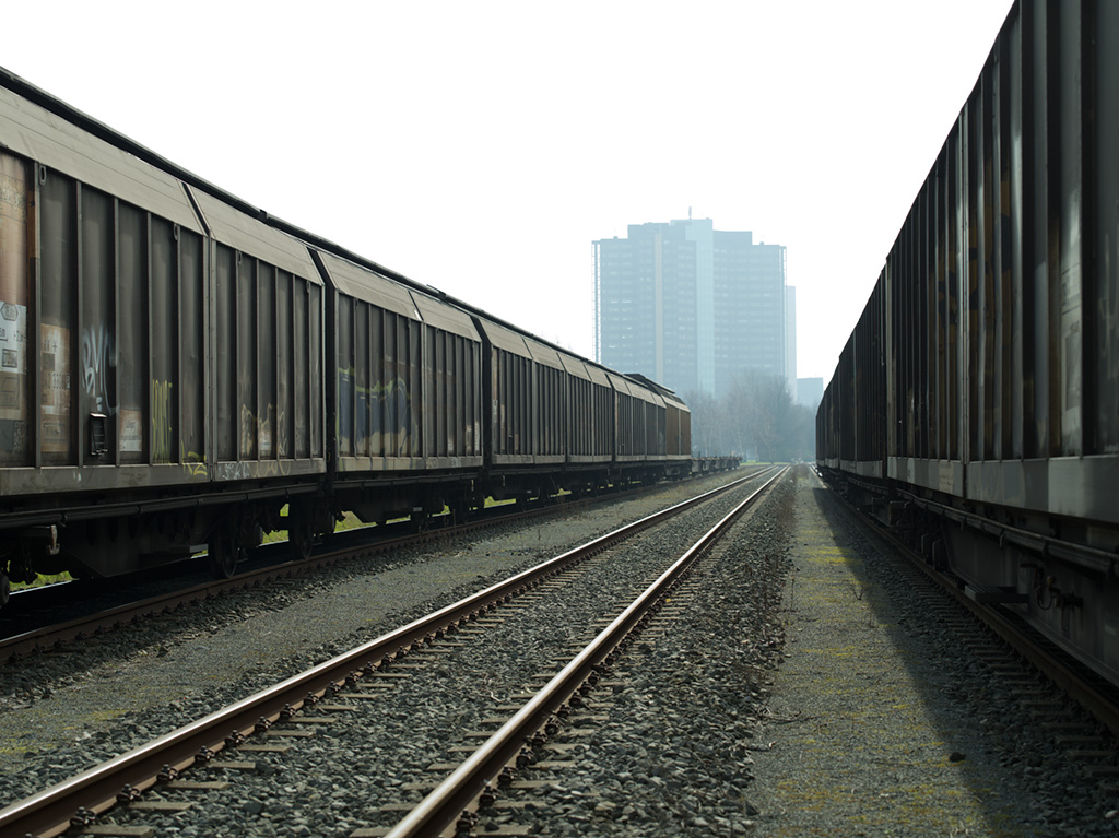 Two freight trains and an empty track